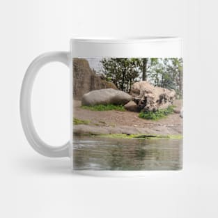 Polar bear walking by lake Mug